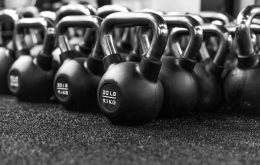 a row of kettles lined up in a gym