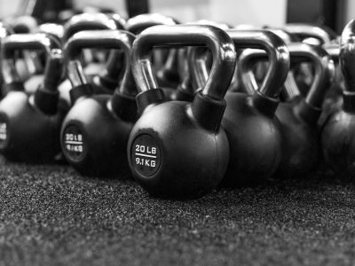 a row of kettles lined up in a gym